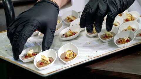 The chefs prepare food samples and treat visitors Stock Footage 127803443