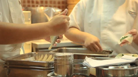 Chefs preparing food in kitchen Video stock 64995182