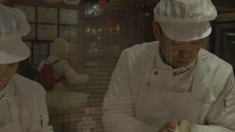 Chefs Preparing Handmade Food at Beijing Street Food Stall in China Stock Footage 345856682