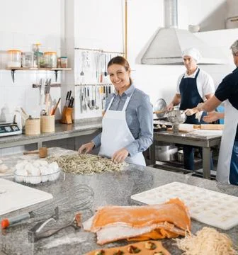 Chefs Preparing Pasta In Kitchen 写真素材