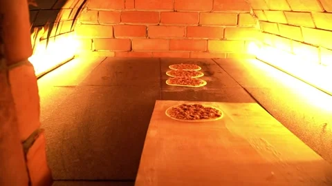 Chefs Preparing Pizza in a Brick Oven Stock Footage 319950357