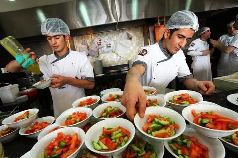 Chefs preparing salad Stock Photos