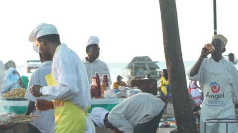 Chefs preparing snacks at a food stall Stock Footage 85780715
