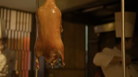 Chefs Preparing Whole Cooked Duck in Beijing Restaurant Kitchen, China Stock Footage 345788279