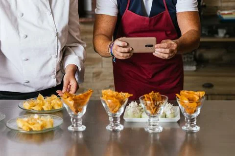 Chefs presenting culinary creations during cooking course Stock Photos