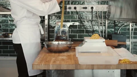 Chefs in protective masks and gloves prepare food in the kitchen of a restaurant Stock Footage 146177448