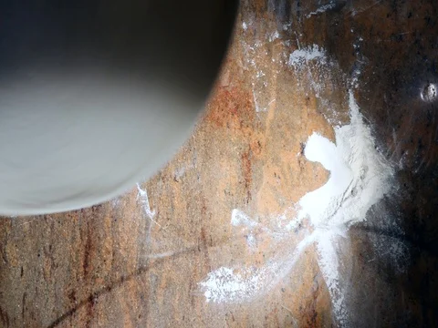 Chefs rotate pizza dough in the air. Top view Stock Footage