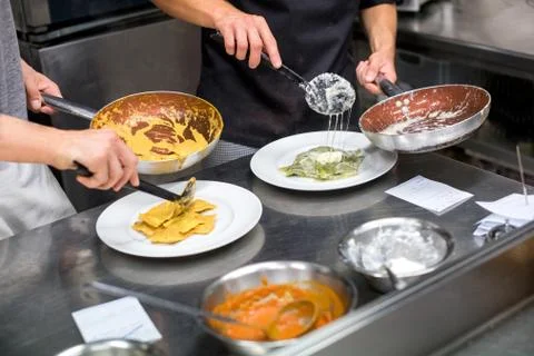 Chefs serving ravioli pasta Stock Photos