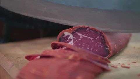 A chef's slicing Turkish bacon. Stock Footage 146638143