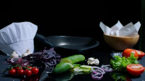 Chef's table with cooking products on the black background for commercial Video stock 92552597