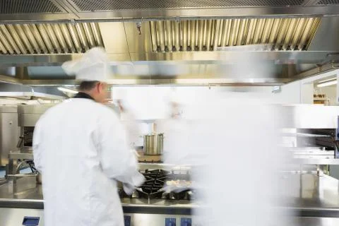 Chefs working in a kitchen Stock Photos