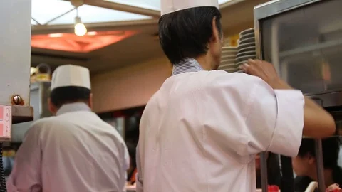 Chefs working in the kitchen of a sushi restaurant in Tokyo,  Japan Stock Footage 95308036