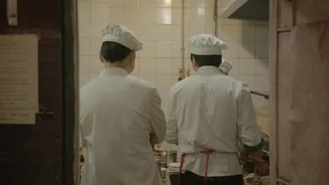 Chefs Working Together in Restaurant Kitchen, Beijing, China, Preparing Food Stock Footage 345772256