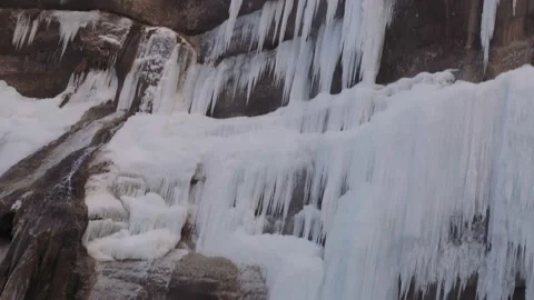 Chegem waterfall in the Caucasus Mountains in winter. The water froze into long Video stock 147332179