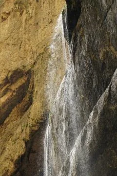 Chegem waterfall falling from a cliff with splashes in the mountains Stock Photos