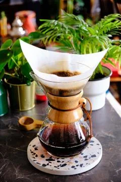 Chemex filter coffee brewing method. Brewing coffee at home. Concept for home Stock Photos