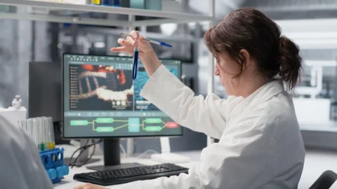 Chemical engineer using laboratory glassware with blue indicator solution Stock Footage 320144416