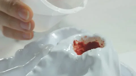 Chemical experience with a red volcano from a test tube. Stock Footage 92237987
