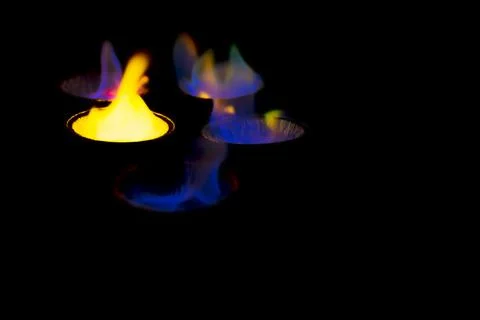 Chemical experiment with fire. multi-colored flames in the dark. Stock-Fotos