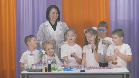 Chemical experiments for children. Fun experiments for children. A woman Stock Footage 127455874