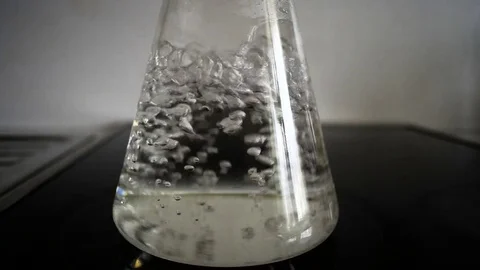 Chemical flask with boiling water Stock Footage