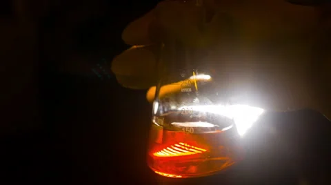 Chemical in flask shake shaking Stock Footage