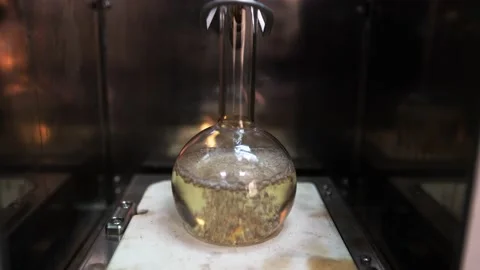 Chemical laboratory. Flask is boiling Stock Footage 166455137