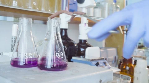 Chemical laboratory. Flask with boiling solution Stock Footage 91613378