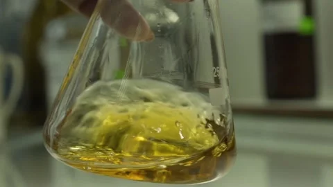 Chemical liquid being mixed inside a medical flask. Stock Footage 132963800