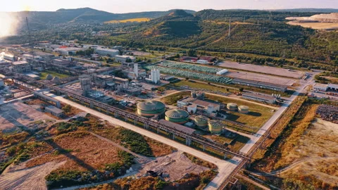 Chemical processing complex with tanks and elevated pipelines. Drone view of Stock Footage 339368256