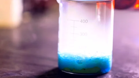 Chemical reaction in a beaker. Stock Footage 246956462
