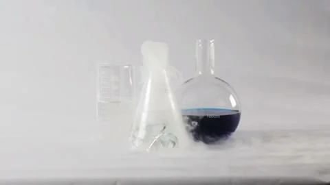 Chemical Reaction In Flasks. Boiling  liquid in flask Stock Footage 86471849
