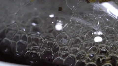 Chemical reactions creating bubbles in laboratory Stock Footage 148019966