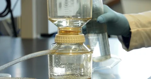 Chemical sample drips through filter Stock Footage 114181661