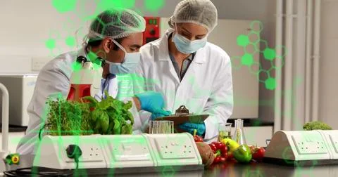 Chemical structures and data processing against make and female health workers Stock Photos