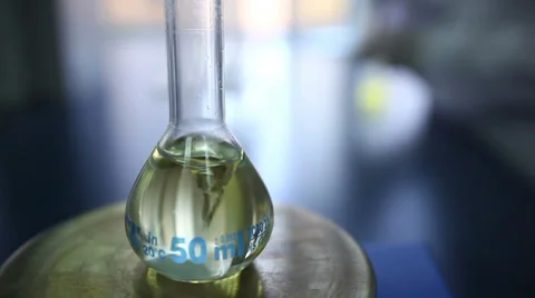 Chemicals mixed in volumetric flask Stock Footage 36635785