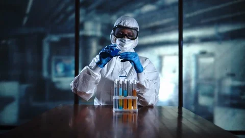 Chemist Adding Chemicals into a Mixing Flask Experiment. High technology Stock Footage 95090764