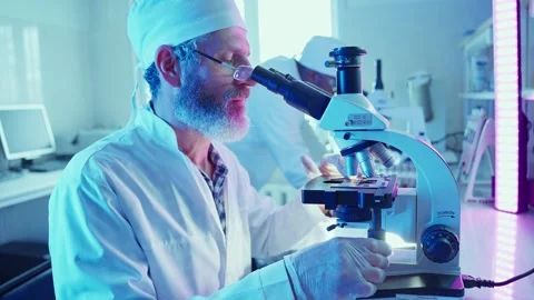 Chemist Analyzing Samples in Innovative Laboratory With Neon Lighting 스톡 동영상 282507938