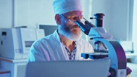 Chemist Analyzing Samples in a Neon-Lit Laboratory During Innovative Research Stock Photos