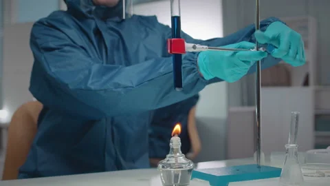 Chemist Conducting Experiment with Flammable Liquid in Lab Stock Footage 234981878