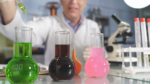 Chemist conducting laboratory research with microscope, test tubes, medicines. Stock Footage 145220822