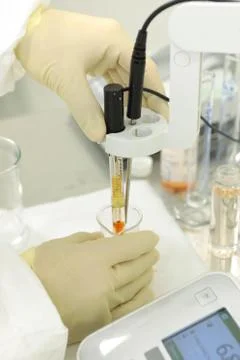 A chemist conducts a study of the stiffness of the solution. Laboratory PH Stock Photos