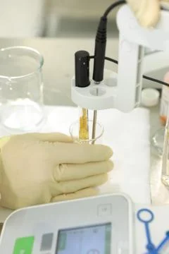 A chemist conducts a study of the stiffness of the solution. Laboratory PH Stock Photos