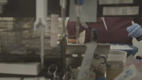 Chemist in a crowded laboratory Stock Footage 129411141