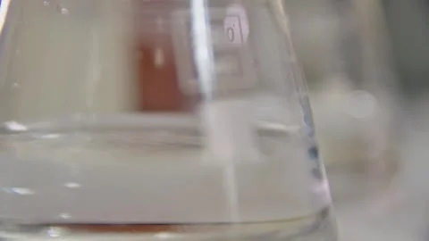 A chemist drips from a dropper pipette into a test tube in the laboratory 스톡 동영상 275074972