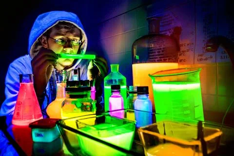 Chemist experimentalizes in the laboratory. Stock Photos