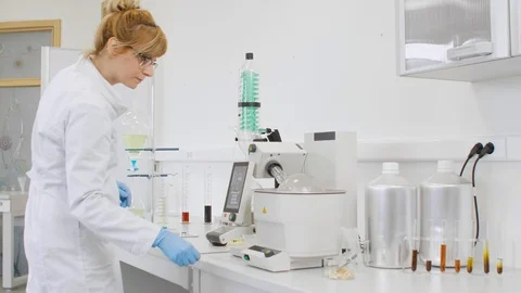 Chemist extracting cbd with rotavapor in laboratory Stock Footage 128587717
