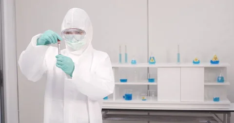 Chemist group working with a microscope in laboratory, developing a vaccine Видео 133095383