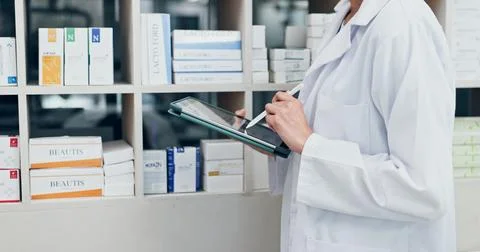 Chemist, hands and writing in pharmacy with tablet, inventory management and Stock Photos