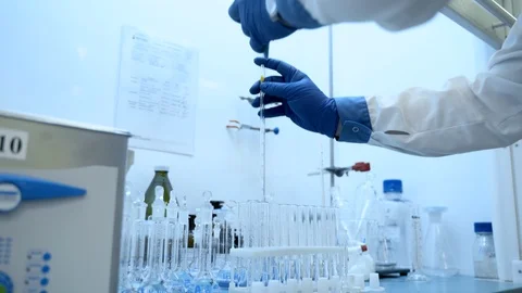 Chemist hands using pipette and vial. dropping sample into test tube. Laboratory Stock Footage 127793865